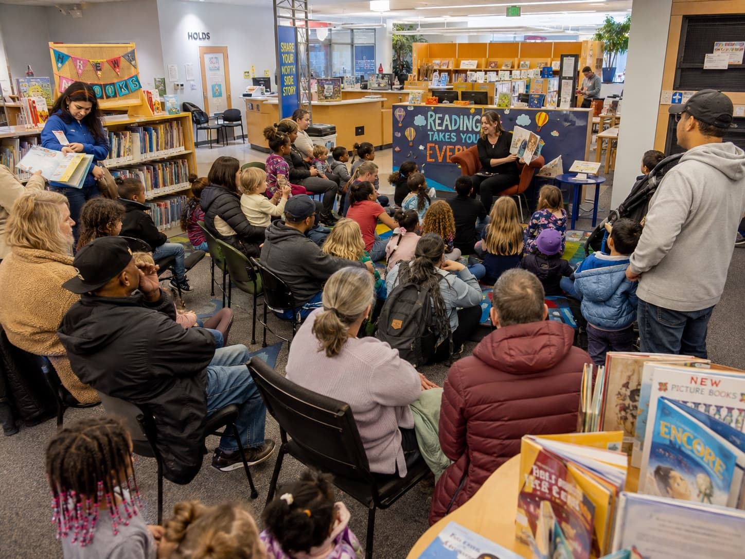 Children and families gathered for storytime in a public library