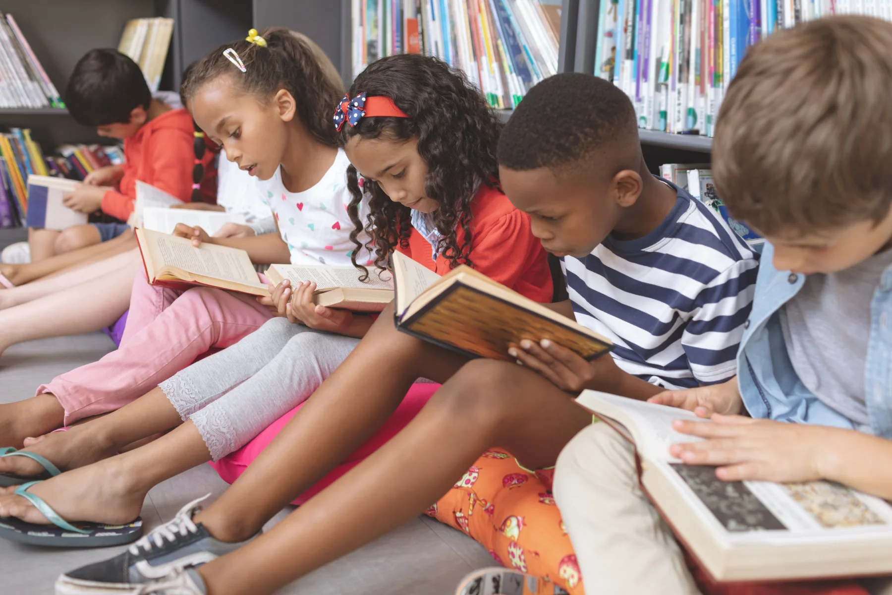 Students reading together in a school library